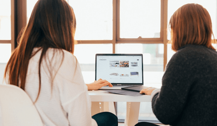 women looking at a laptop